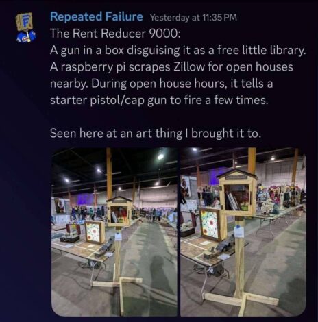 Two "free little library" structures repurposed as cap gun displays at an art fair. The text reads: "The Rent Reducer 9000".