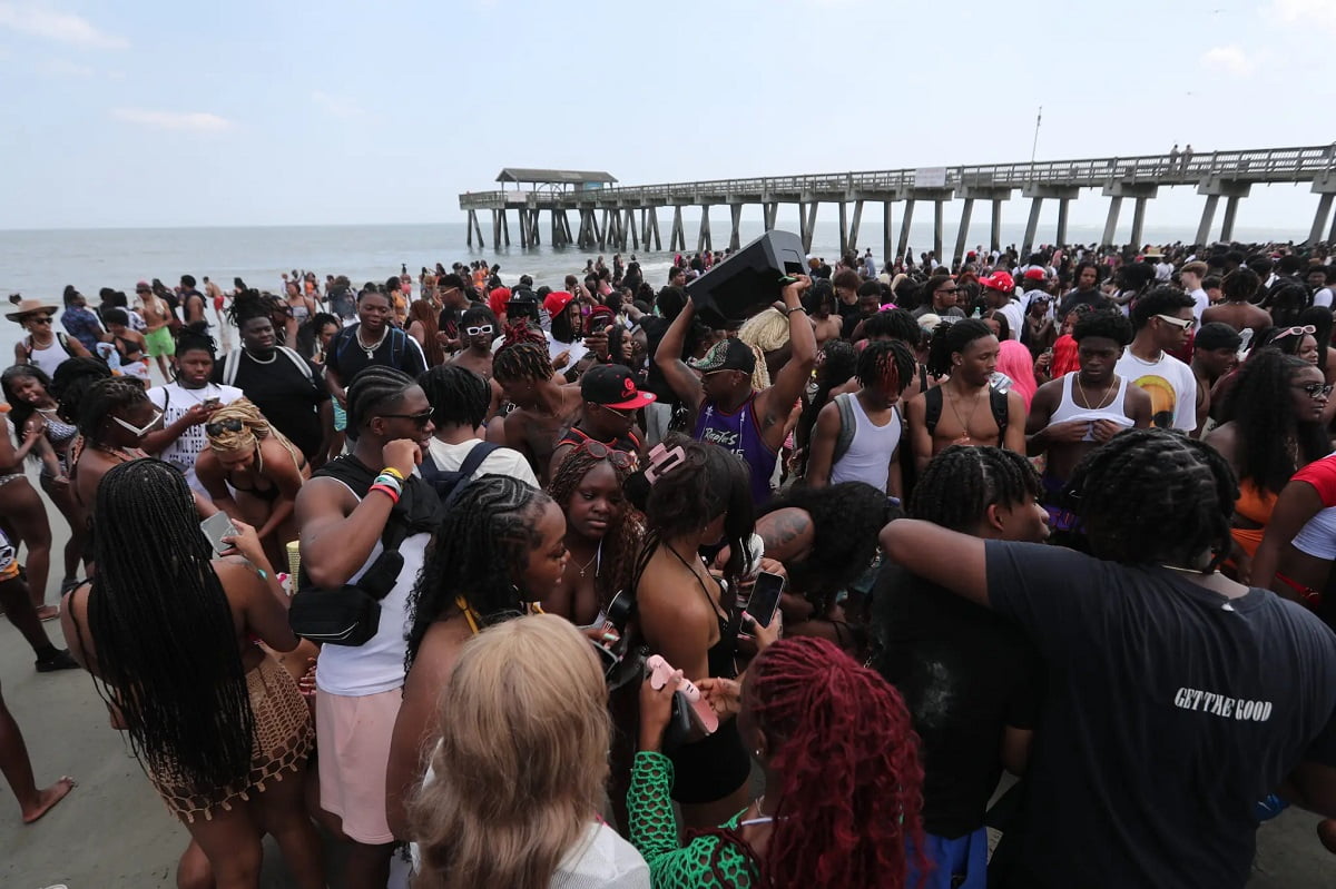 During Orange Crush on Tybee Island, a group of Spring breakers congregated on April 20, 2024. 54 spring breakers arrested at Savannah beach party amid booze-filled brawls, beach completely trashed