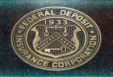 an FDIC logo on a wall