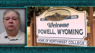 Mugshot of David Kellett, former House candidate from Powell, Wyoming, beside a "Welcome to Powell, Wyoming" sign, referencing the town where he faces child abuse charges. The sign reads "Home of Northwest College.