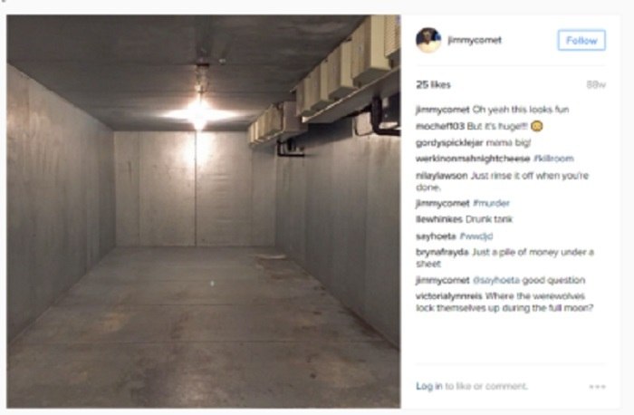 Empty concrete room with a single overhead light.