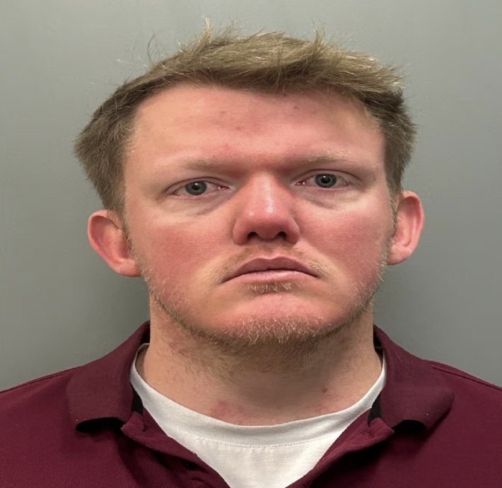 Booking photo associated with Jacob Marcus Clifford, a Mobile police detective charged in Baldwin County.
