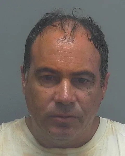 Mugshot of Enzo Vincenzi, a man with dark hair and a serious expression. This image is related to a case involving allegations of false arrest, police assault, and wrongful imprisonment in North Fort Myers, Florida, with Lee County deputies involved.