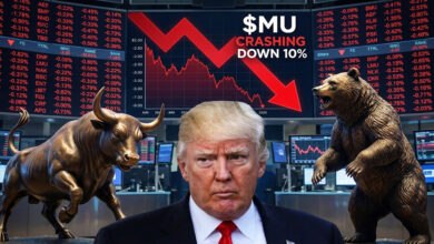Former President Donald Trump stands beside a stock market graph showing a significant decline, flanked by bronze statues of a bull and a bear. The graph prominently displays the text "$MU CRASHING DOWN 10%".