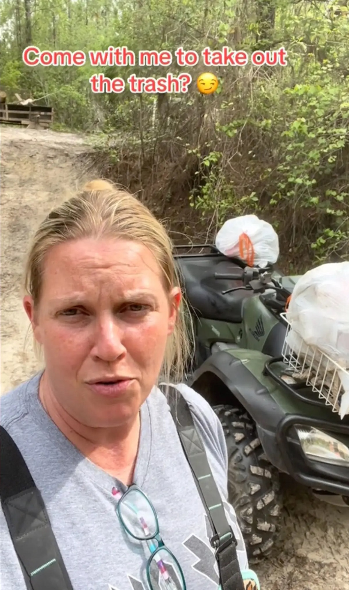 Upon reaching shore, she utilizes an ATV to complete the journey to the waste receptacle. Woman has to travel through gator-infested waters just to take her trash out every week