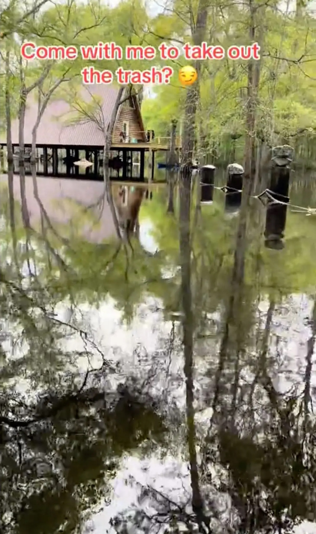 Katie sets off down the river with her furry companion. Woman has to travel through gator-infested waters just to take her trash out every week