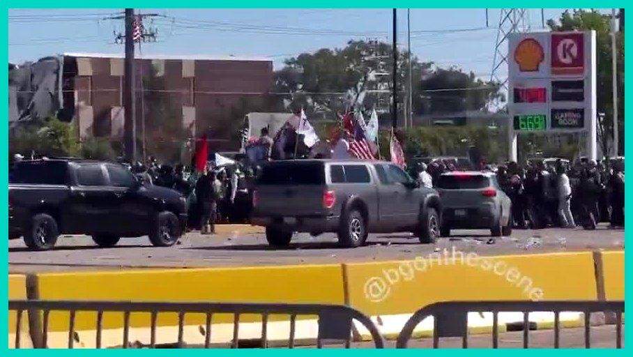 Screenshot of trucks, barriers, and flag-waving crowds at the Bridgeview gas-station protest