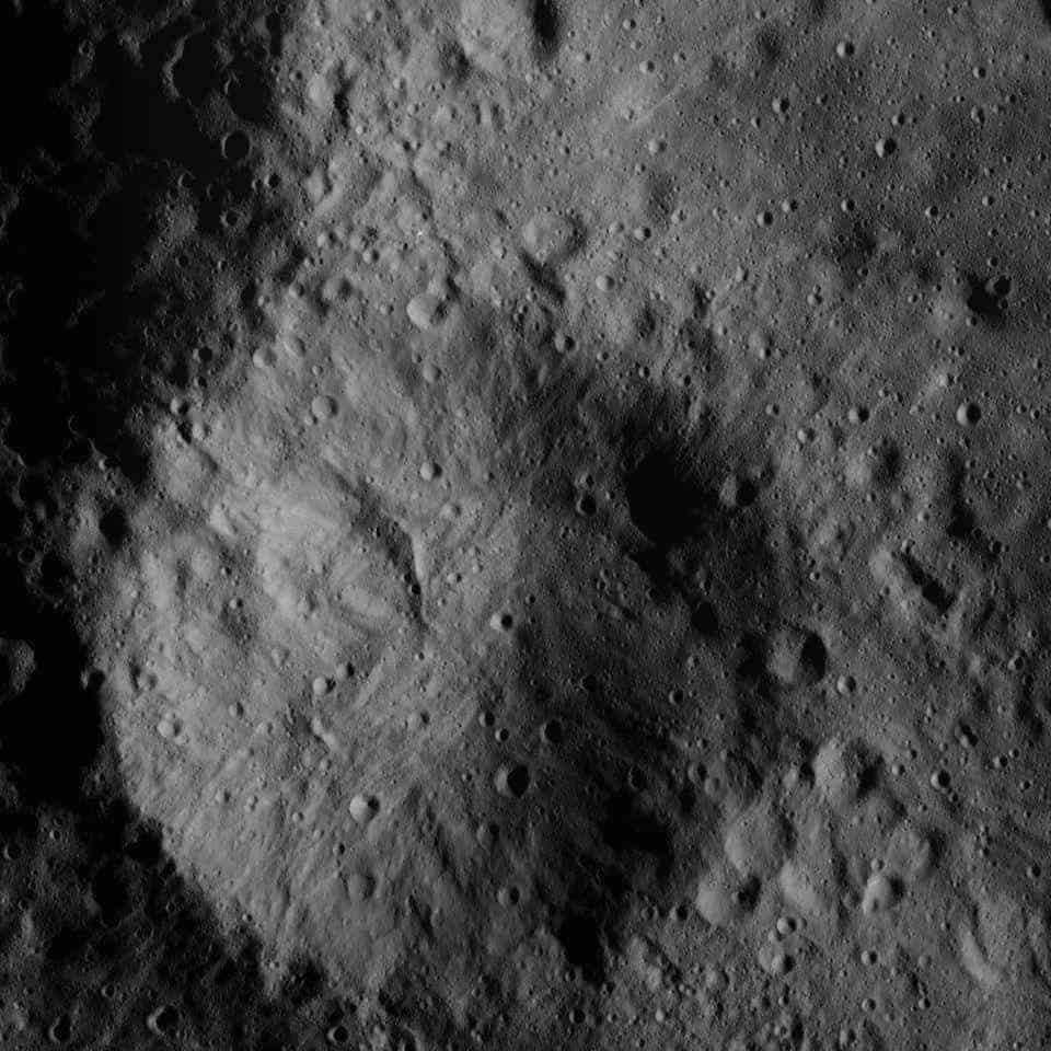 A small boulder located on the surface of Ceres, captured by Dawn at an altitude of 24 miles
