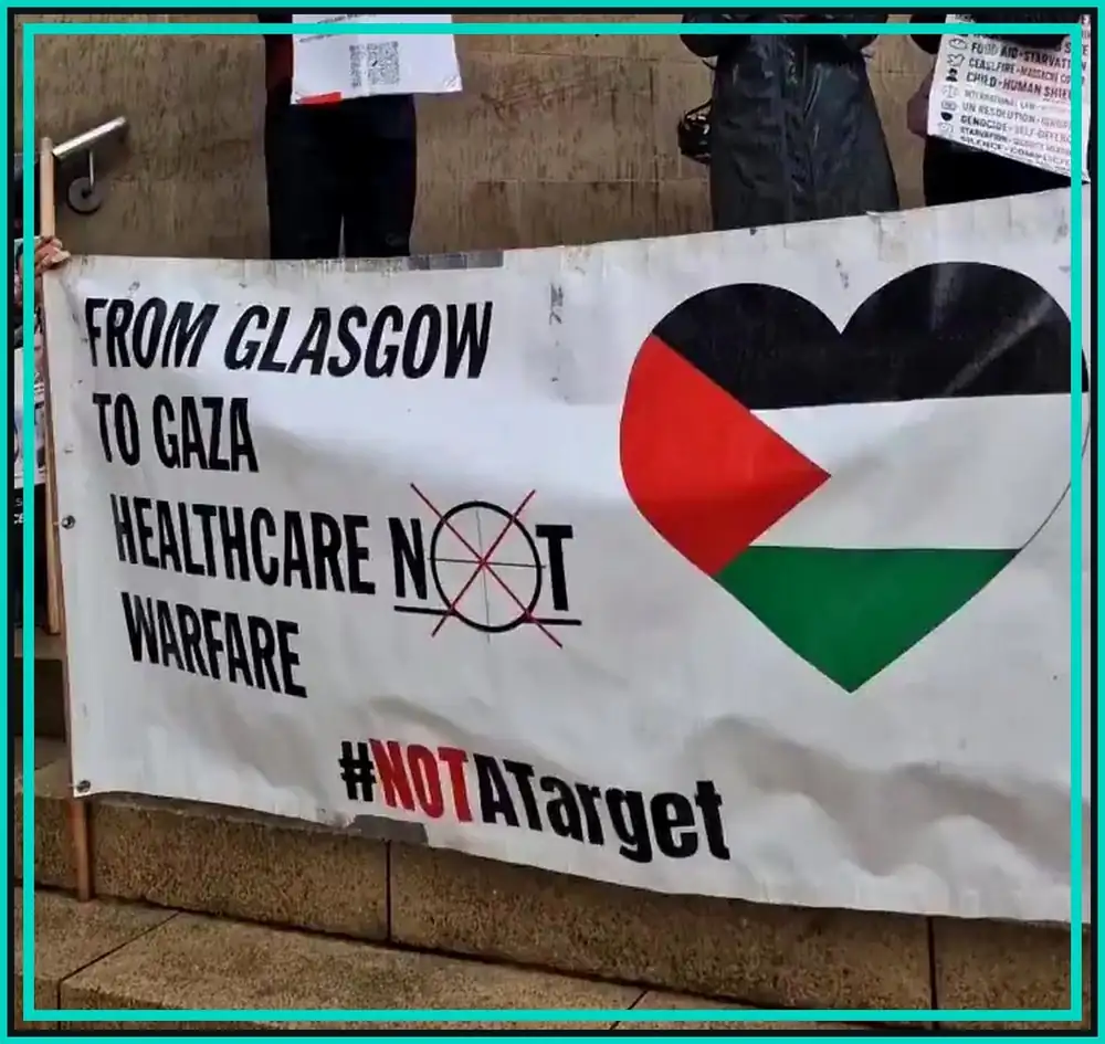 Glasgow banner reading healthcare not warfare at a protest for detained Palestinian medics