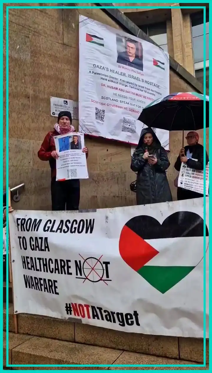 Glasgow protest with a portrait of detained paediatrician Dr Hussam Abu Safiya