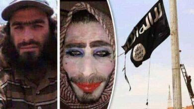 A man with a long beard and baseball cap is juxtaposed with another wearing a headscarf and heavy makeup, including purple eyeshadow and red lipstick, likely an ISIS militant in disguise. The image is related to the Raqqa liberation and the end of ISIS in Syria.