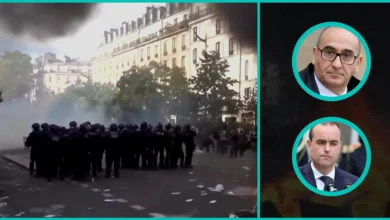 French riot police beside a burning street, with Interior Minister Laurent Nuñez and Prime Minister Sébastien Lecornu in bright teal ovals