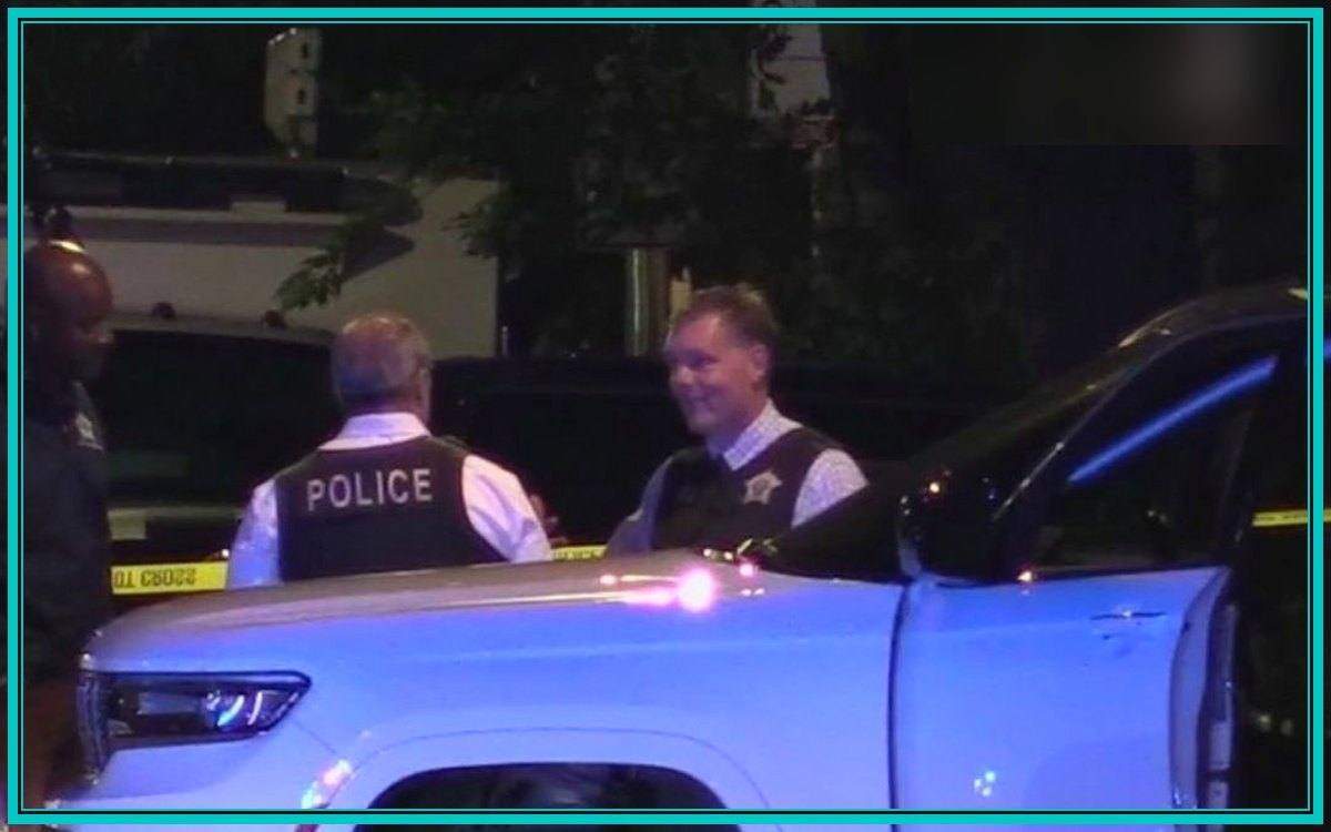 Chicago police investigators beside a white SUV inside a taped crime scene in Little Village after an off-duty officer shooting