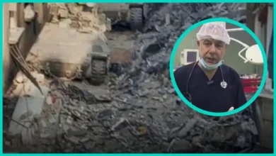 Dr Hussam Abu Safiya in a bright teal frame over rubble left after Israeli forces raided Kamal Adwan Hospital