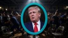 Donald Trump in a bright teal oval frame as a protester is removed during the Vandalia rally over the Epstein files