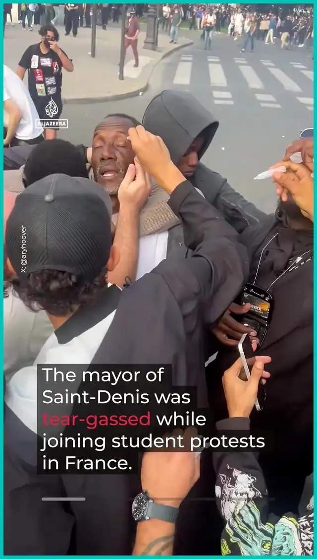 Screenshot of Saint-Denis Mayor Bally Bagayoko having his eyes rinsed after police tear gas during student protests in France